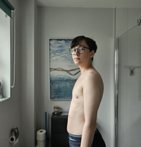 A side-on photo of the author, whose chest is indeed flat.